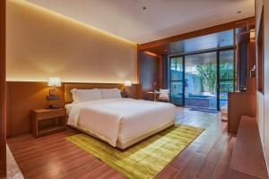 Voodi või voodid majutusasutuse Guangdong Hot Spring Hotel toas