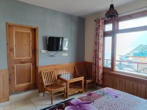 TV a/nebo společenská místnost v ubytování Leela Home - Full Mountain View
