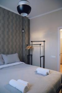 Ένα ή περισσότερα κρεβάτια σε δωμάτιο στο Apartment 1905 in Tbilisi, Avlabari