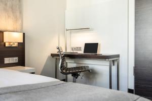Postel nebo postele na pokoji v ubytování Garner Hotel Berlin - Mitte by IHG