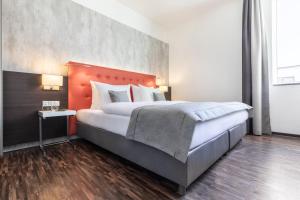 Postel nebo postele na pokoji v ubytování Garner Hotel Berlin - Mitte by IHG
