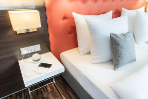 Postel nebo postele na pokoji v ubytování Garner Hotel Berlin - Mitte by IHG
