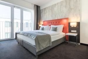 Postel nebo postele na pokoji v ubytování Garner Hotel Berlin - Mitte by IHG