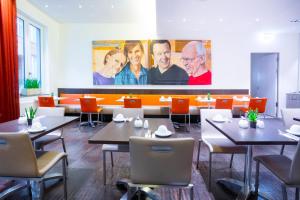 TV a/nebo společenská místnost v ubytování Garner Hotel Berlin - Mitte by IHG
