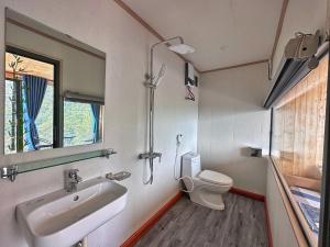 a bathroom with a sink and a toilet at Valley Bungalow - Venuestay in Tam Ðảo