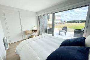 Posteľ alebo postele v izbe v ubytovaní T3 Neuf Archi Cocooning Terrasse Face à la mer