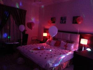 Postelja oz. postelje v sobi nastanitve Lara Al Jawf Hotel Apartments