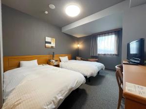 TV a/nebo společenská místnost v ubytování Hotel Route-Inn Jouetsu