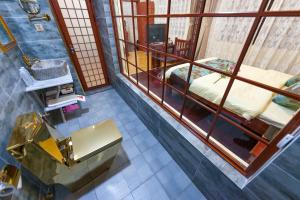 an overhead view of a room with a bed and a mirror at Dali Classical Rosewood Boutique Inn in Dali Ancient Town