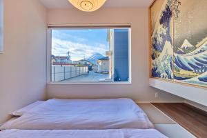 Ένα ή περισσότερα κρεβάτια σε δωμάτιο στο Fuji Kurasu 心