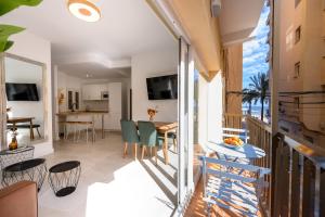 a room with a balcony with a table and chairs at La Paz by 10toSea in Fuengirola