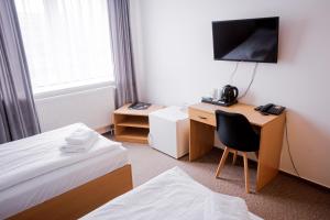 Letto o letti in una camera di Hotel Arena Liberec