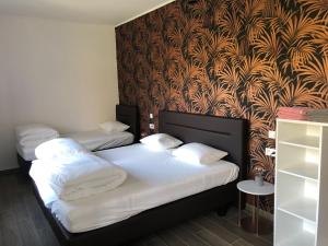 Postel nebo postele na pokoji v ubytování Gîte Ôfé