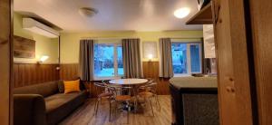 a living room with a couch and a table at Piiri Holiday House in Otepää
