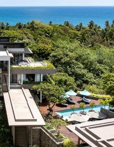 an aerial view of a resort with a swimming pool and the ocean at Ziba Luxury Villa in Tangalle
