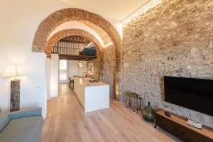 TV a/nebo společenská místnost v ubytování Residenza IL BORGO