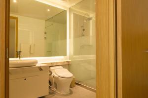 a bathroom with a toilet and a sink and a shower at Leesangwon Museum of Art - Museumstay in Tŏkkol-mal