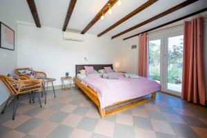 a bedroom with a large bed and a table and chairs at Bella di Campo in Rovinj +63 photos