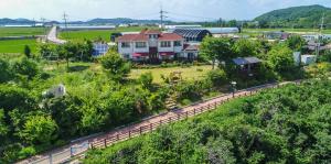 an aerial view of a train station with a train track at Moon Rivers in Cheorwon