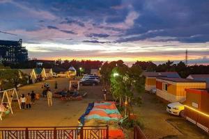 a group of people in a parking lot with tents at Seocheon Beach Glamping in Seocheon