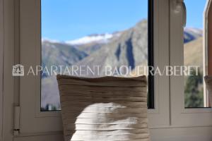 a window with a view of a mountain at Apartarent 1500 in Baqueira-Beret