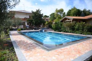 a swimming pool in the backyard of a house at Etna Casa del Sole in Nicolosi