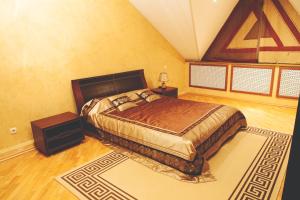 a bedroom with a large bed in a room at AlGrado Hotel in Kislovodsk