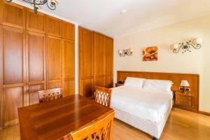 Voodi või voodid majutusasutuse Altea Suites toas