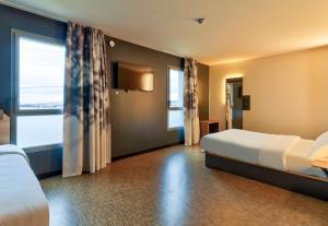 Postel nebo postele na pokoji v ubytování B&B HOTEL Dijon Valmy Toison d'or