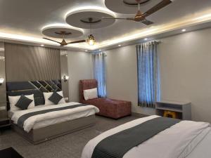 Voodi või voodid majutusasutuse Hotel Grand Safari toas