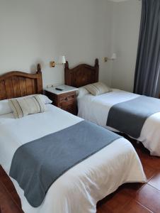 Ένα ή περισσότερα κρεβάτια σε δωμάτιο στο Hotel Artea Errota