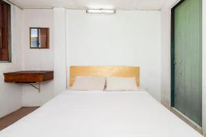 Postel nebo postele na pokoji v ubytování SPOT ON 89916 Gold Star Hotel