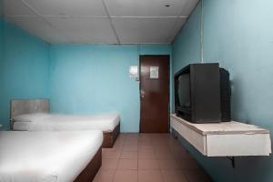Postel nebo postele na pokoji v ubytování SPOT ON 89916 Gold Star Hotel