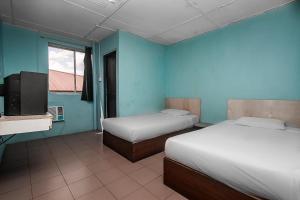 Postel nebo postele na pokoji v ubytování SPOT ON 89916 Gold Star Hotel