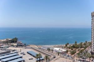 an aerial view of a city and the ocean at One bedroom apartment next to the port in Fuengirola