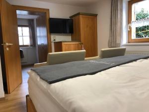 Postel nebo postele na pokoji v ubytování Haus Frainer