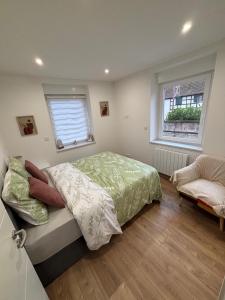Ένα ή περισσότερα κρεβάτια σε δωμάτιο στο Appart cosy Jalila