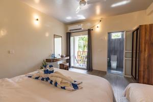 Voodi või voodid majutusasutuse Dhoadhi Beach Maldives toas