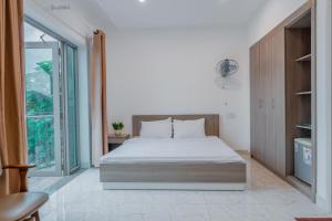 Letto o letti in una camera di Red Coral Hotel