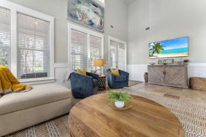 a living room with a couch and a table at 1369 Laurel Grove "The Crows Nest" in Destin