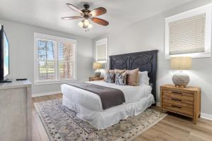 a bedroom with a bed and a ceiling fan at 1369 Laurel Grove "The Crows Nest" in Destin +37 photos