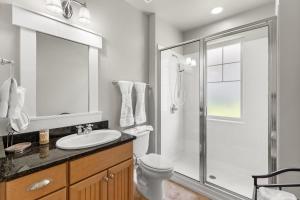 a bathroom with a shower and a toilet and a sink at 1369 Laurel Grove "The Crows Nest" in Destin