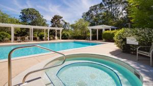 a swimming pool with a hot tub in a yard at 1369 Laurel Grove "The Crows Nest" in Destin