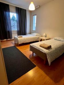 Ένα ή περισσότερα κρεβάτια σε δωμάτιο στο Rent a box Raisio for 6 +10 φωτογραφίες