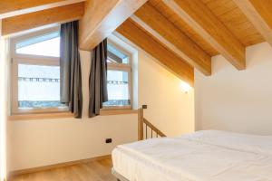 A bed or beds in a room at Residence Nevegall