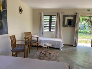 Postel nebo postele na pokoji v ubytování Le Jardin de Beau Vallon