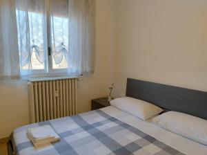 Postel nebo postele na pokoji v ubytování La Terrazza su Monza Casa Vacanze