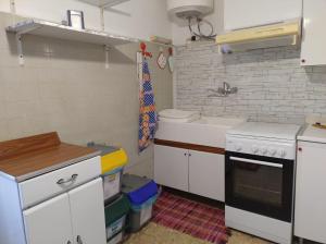 Kuchyň nebo kuchyňský kout v ubytování La Terrazza su Monza Casa Vacanze