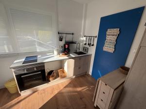 a small kitchen with a counter and a stove at Grupo Gontad Apartamento Mourelle Corme in Corme-Puerto