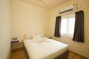 Postel nebo postele na pokoji v ubytování Lazo Avarta Resort and Convention Centre Pondicherry